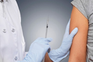 image of nurse giving an shot into an arm.