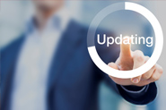 Image of guy in suit touching screen that says updating.