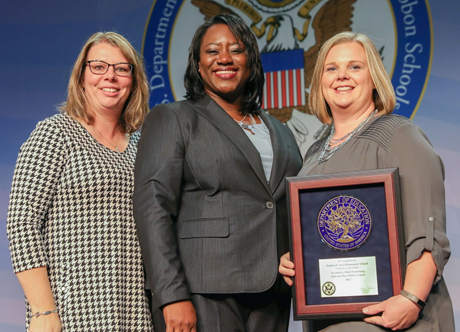 Image of representatives of Frederick Elementary School being presented award.