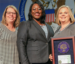 Images of representative from Frederick Elementary being presented award.