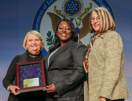 Image of representatives of Immaculate Conception School being presented award. 