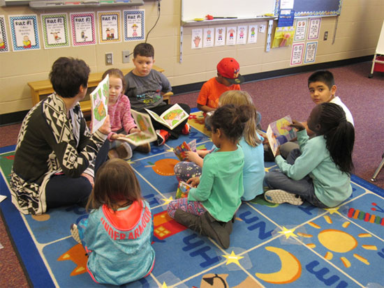 Students reading books in classroom at Fred Assam Elementary 