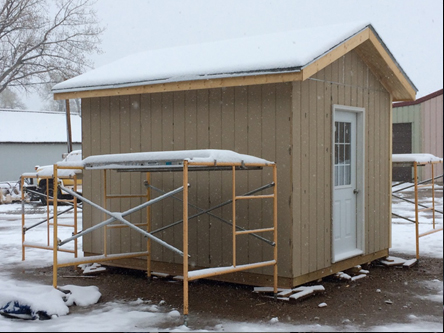 Photo of a shed. Caption: Geometry in Construction students are building this shed.