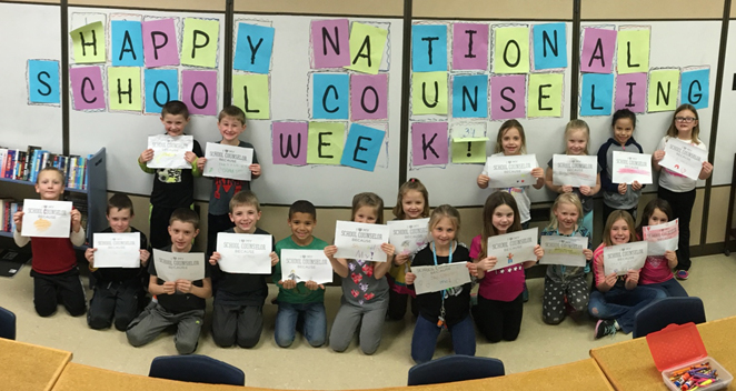 Images of students from Castlewood Elementary stnading in front of sign that says Happy National School Counseling Week