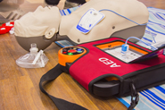 Image of CPR mannequin and AED devices that are used to teach CPR