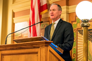 Image of Gov. Dennis Daugaard speaking at podium.