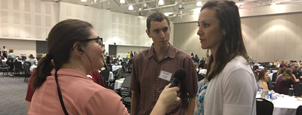 Image of teachers being interviewed by media