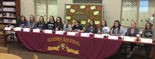 students sitting at table